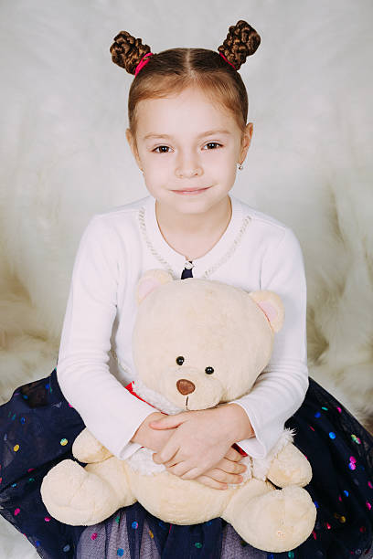 istock Cute little girl with Teddy bear 502213956