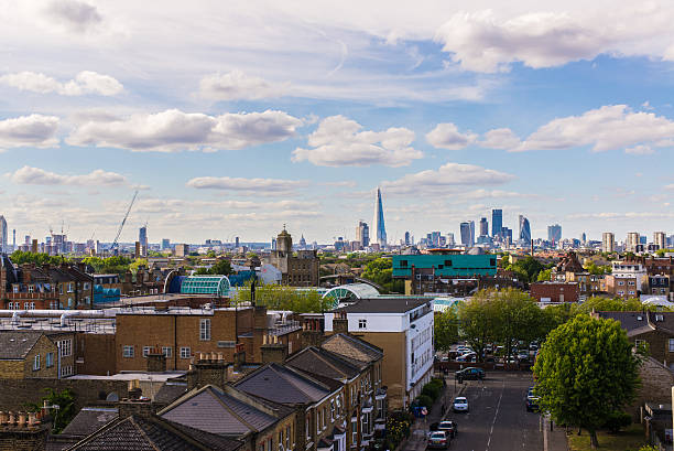 Residential area with flats in south London Residential area with flats in south London with a view of the city of London and its most iconic skyscrapers. Shot in Peckham, South London. southwark stock pictures, royalty-free photos & images