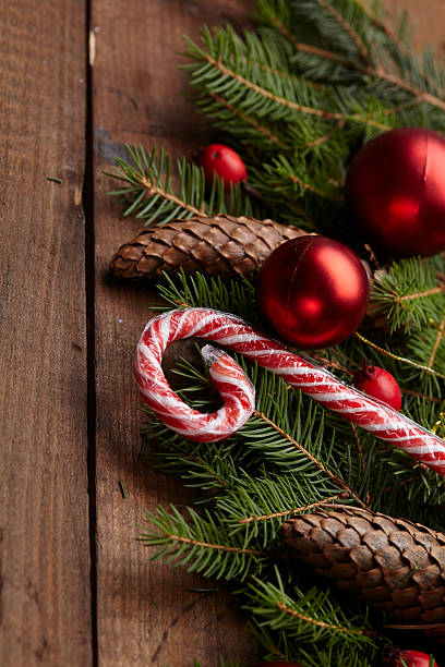 istock Christmas tree branch, candy, cones, balls on the background of 502215996