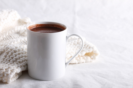hot chocolate drink in white mug on white background