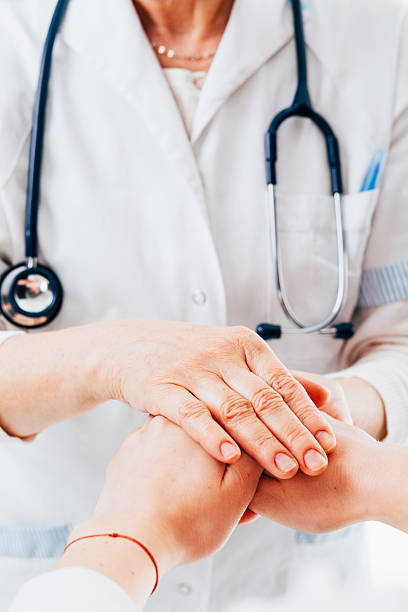 istock Doctor holding patient hands 502216156