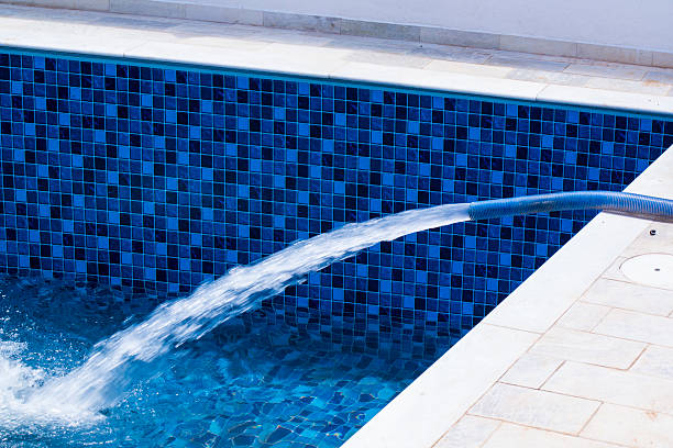 istock Pool filling up with water 502216606