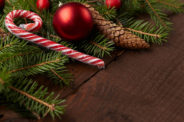 istock Christmas tree branch, candy, cones, balls on the background of 502216830