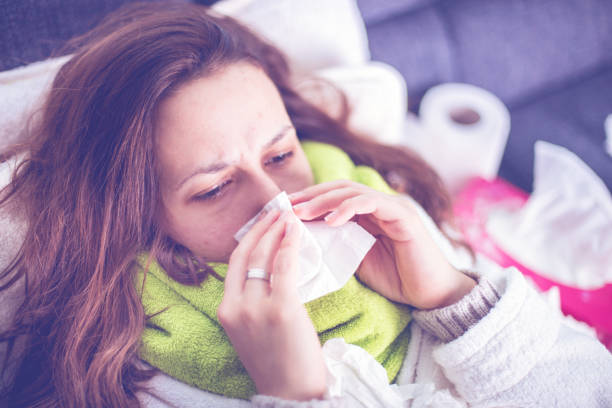 istock Sneezing woman 502217070