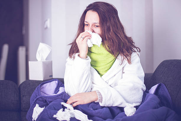 istock Sneezing woman 502217104