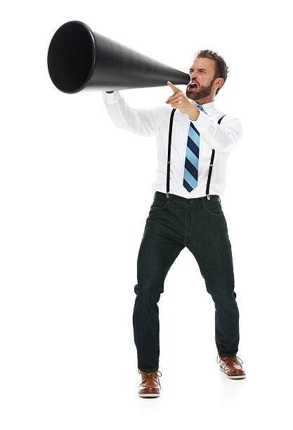 istock Excited businessman shouting with megaphone 502217518