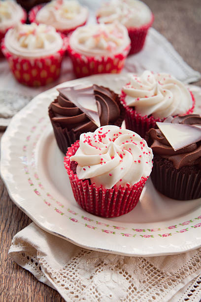 istock White and dark  chocolate cupcakes on natural rustic vintage table 502217666