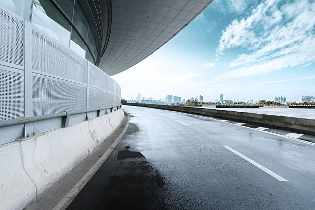 istock empty road and modern building cloudy skyline 502219378