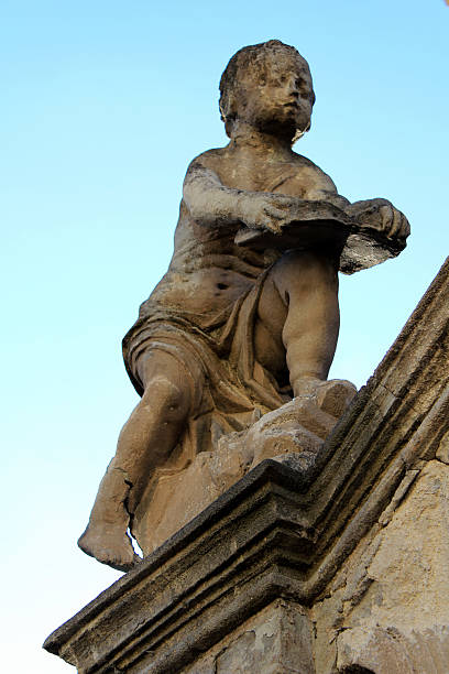 istock sculpture of a boy 502220221