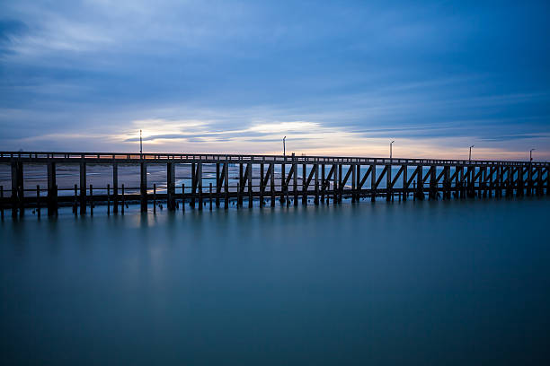 istock the pier whit light pole at the sea 502221470