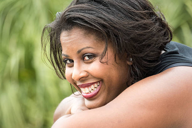 Afro caribbean woman smiling looking at the camera