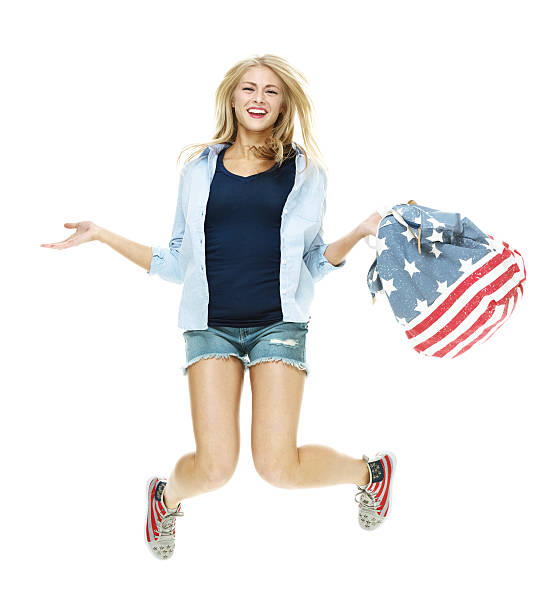 istock Smiling woman jumping and cheering 502224574