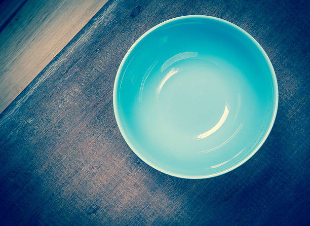 istock Round plate with blue on wood table 502225927