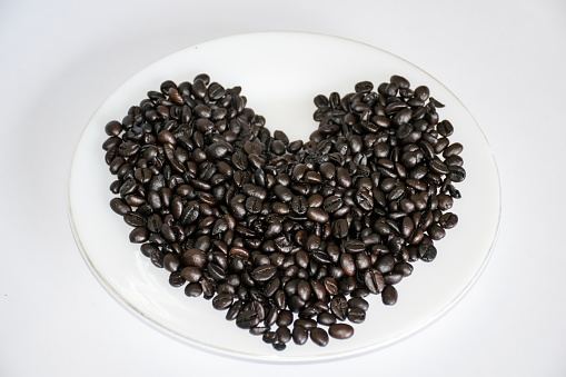 Coffee beans,black Coffee beans ,thailand Coffee beans.Coffee beans  on the dish,goods coffee,coffee,drinking coffee, coffee for morning