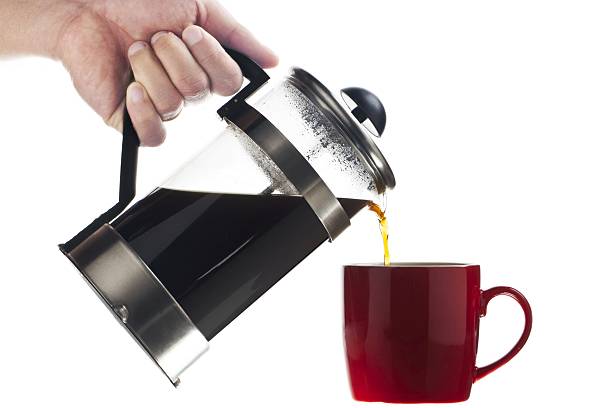 istock human hand with a coffee pot serving coffee against white 502247396