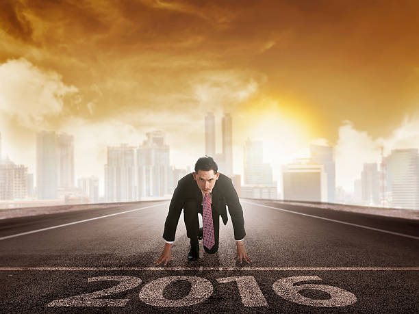 istock Happy new year 2016. young man running 502252092