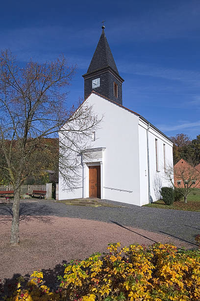 istock Small church building in Rassdorf, Hesse, Germany. 502252570