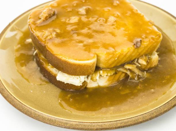 istock Gravy being poared over hot turkey sandwich 502253596