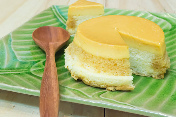 istock slice custard pudding cake in green plate on wood background 502254564
