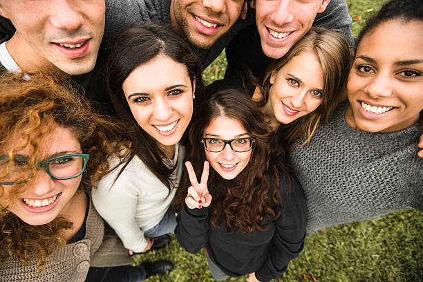 istock Group of college student laughing and doing a selfie 502255320