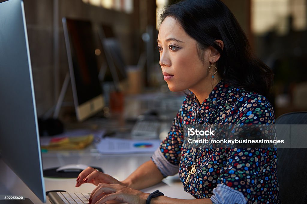 Female Designer Working At Desk In Modern Office Asia Stock Photo