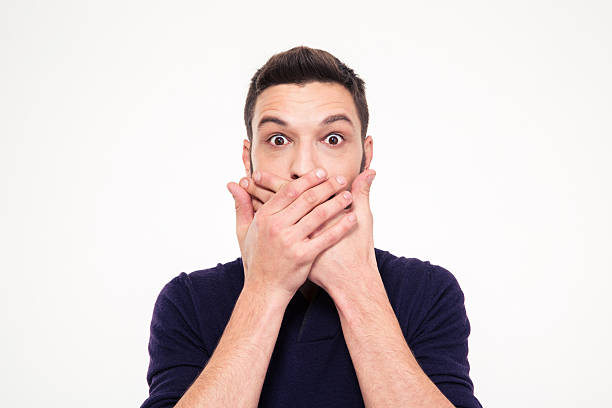 istock Shocked stunned young man covered mouth by hands 502255748
