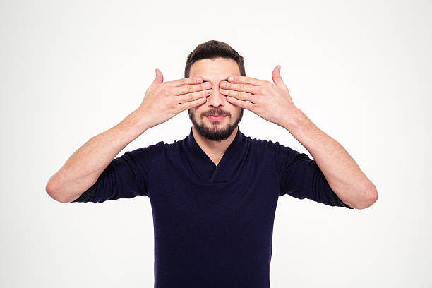 istock Handsome young bearded man closed eyes with hands 502255772