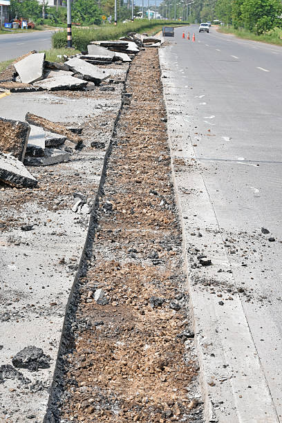 istock Repairing the asphalt pavement on the road. 502256576