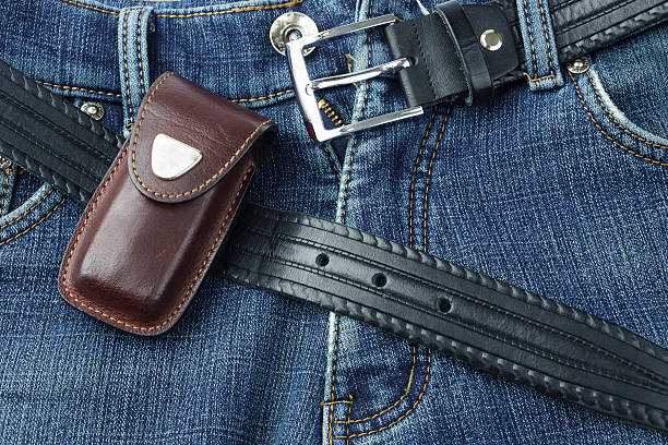 istock Blue jeans with leather belt and knife case 502257052