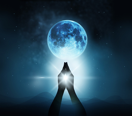 Respect and pray on blue full moon with nature background, Original image from NASA.gov