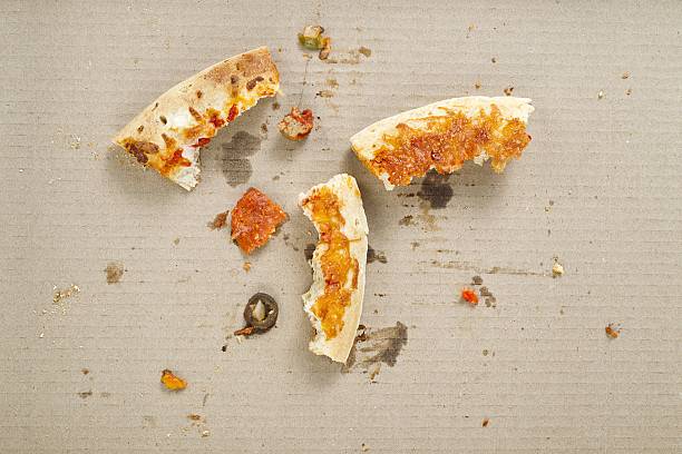 leftover pizza crust heel stock photo