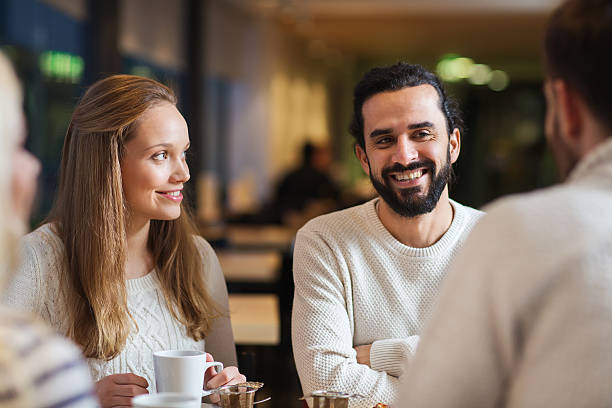 istock happy friends meeting and drinking tea or coffee 502258580