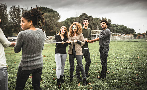 istock Friends doing the Tug of war - teamwork 502259372