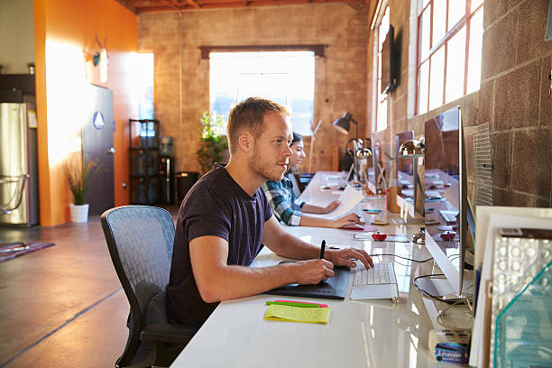 istock Designers Working At Desks In Modern Office 502259814