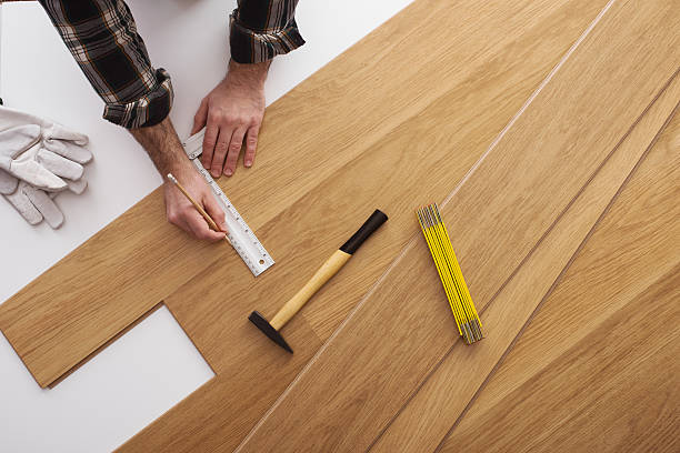 istock Carpenter installing a wooden flooring 502261476