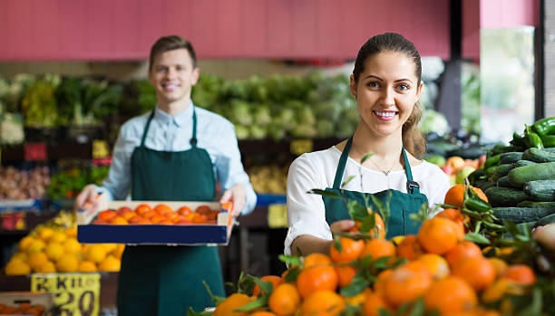 istock Stuff in apron selling sweet oranges, lemons and tangerines 502261952