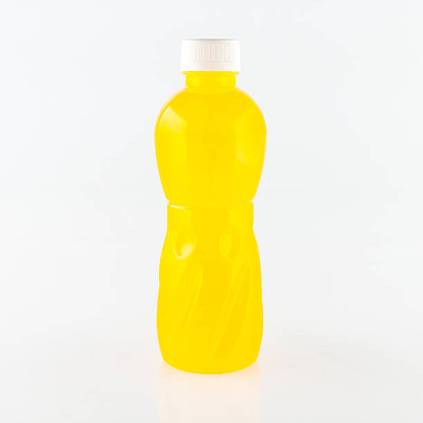 istock Orange juice glass bottle. Isolated on white background 502262254