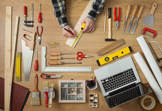 istock Man measuring a wooden plank 502262262