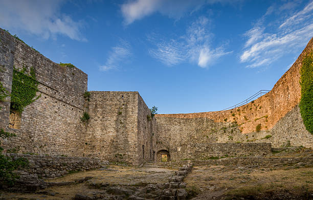 istock Old fortress walls and blue sky view 502262292
