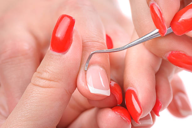istock manicure applying - cleaning the cuticles 502274317