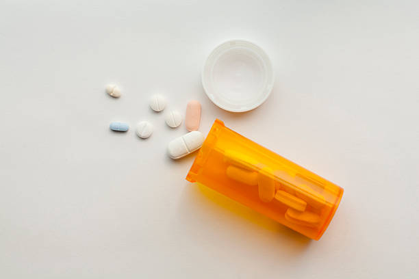 Pills Still life of bottle and pills. prescription medicine stock pictures, royalty-free photos & images