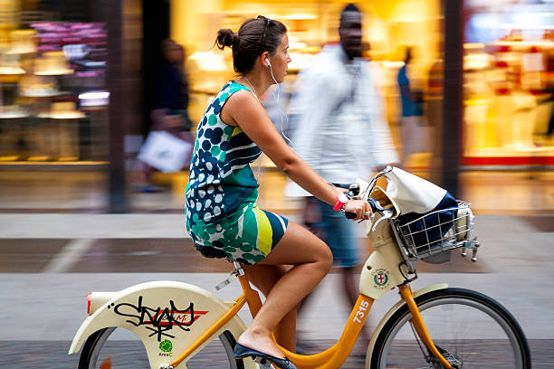 Milan, a girl on "Bike Sharing". Color image stock photo