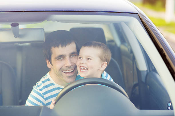 istock Father and son driving car 502274935