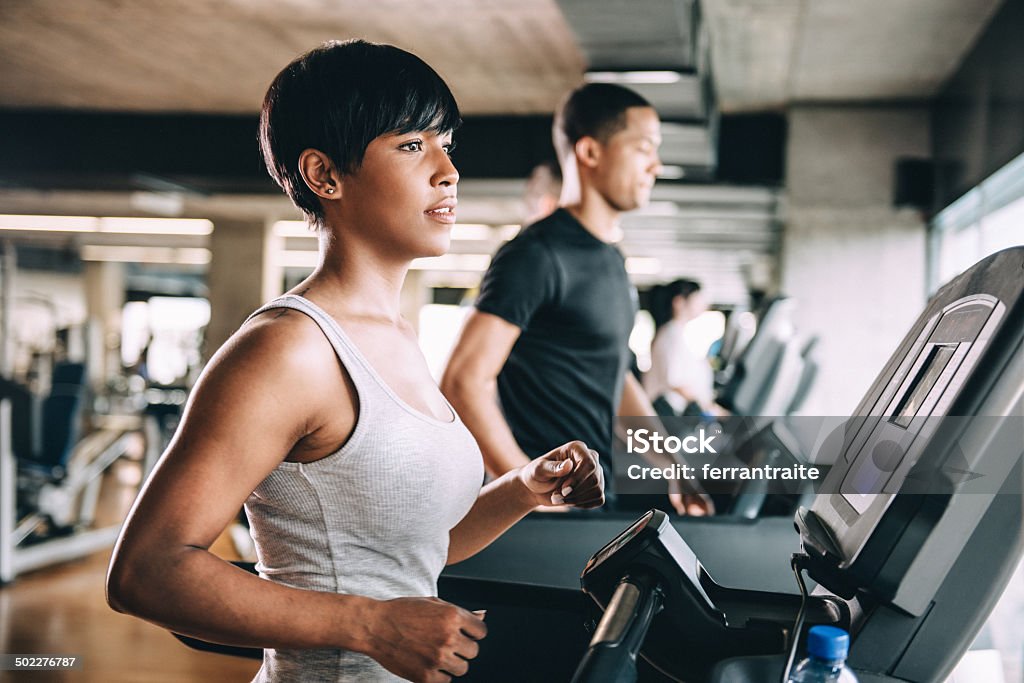 Diverse People Running on Treadmill Treadmill Stock Photo