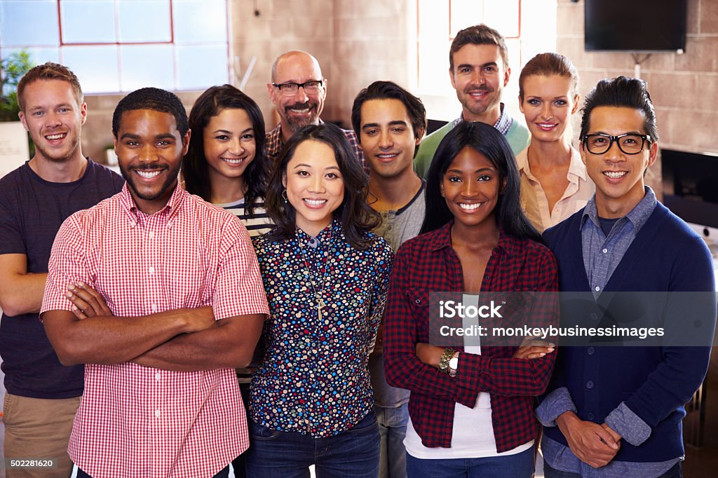Portrait Of Staff Standing In Modern Design Office Multiracial Group Stock Photo