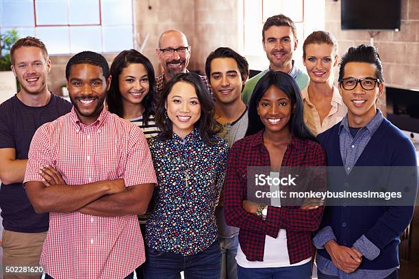 Portrait Of Staff Standing In Modern Design Office Stock Photo - Download Image Now - Multiracial Group, Group Of People, People