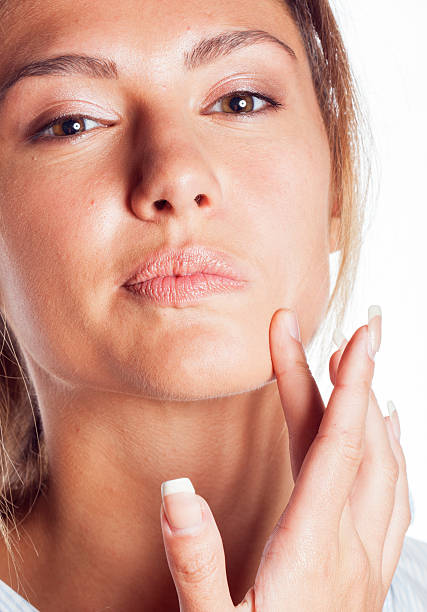 istock woman with pimple making out close up isolated on white 502281704