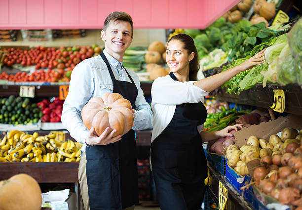 istock Sellers posing with big pumpkin 502285598