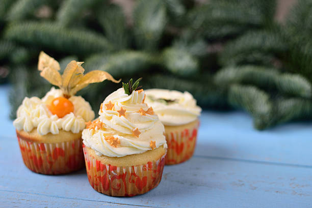 istock choice of three cupcakes on a blue wooden background 502287162