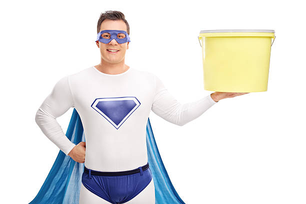 istock Superhero holding a big yellow bucket 502287188